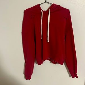 Red ripped sweater